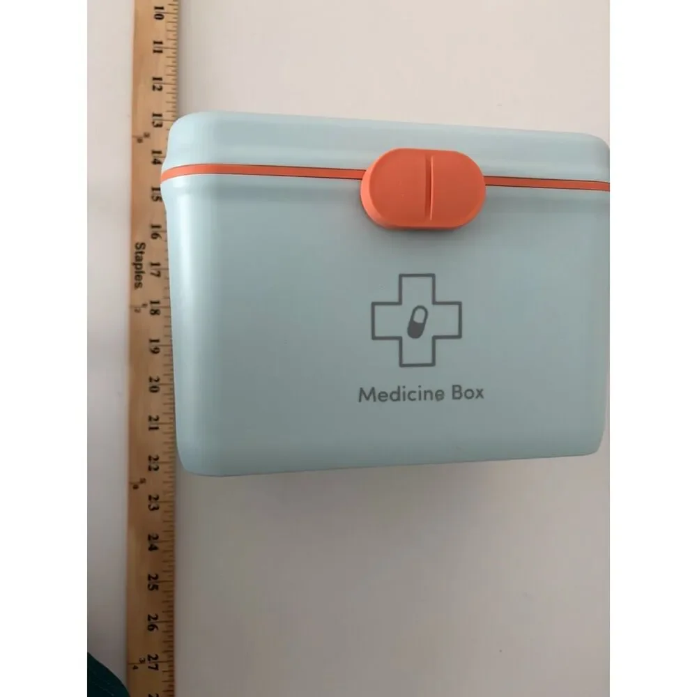 Modern portable plastic medicine box with orange handle and latch